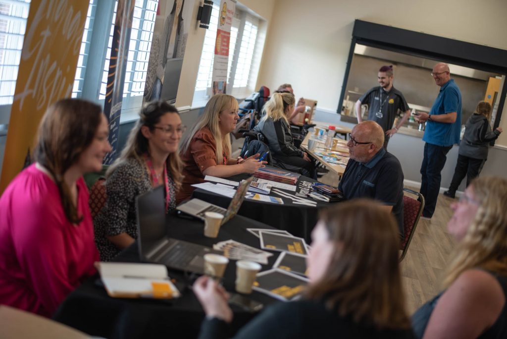 Delegates in discussion around tables at the Proper Good launch event